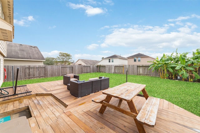 wooden terrace featuring a yard