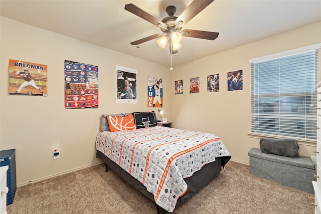 bedroom featuring light colored carpet and ceiling fan