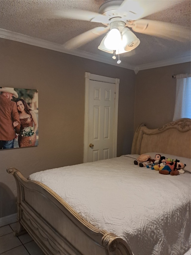 bedroom with tile patterned flooring, ceiling fan, and crown molding