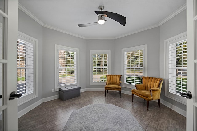 living area with dark hardwood / wood-style floors, ceiling fan, ornamental molding, and french doors