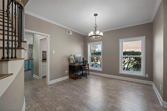 office area with a chandelier, crown molding, and wood-type flooring