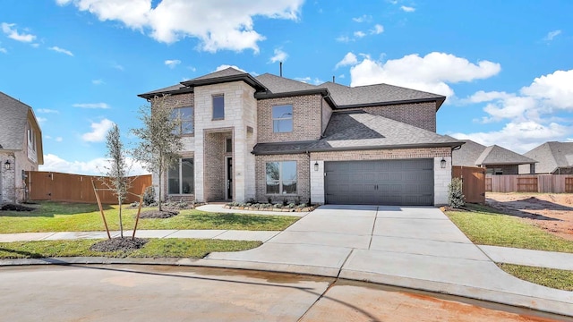 view of front of house with a garage and a front yard