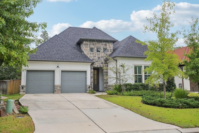 view of front of house with a front lawn and a garage