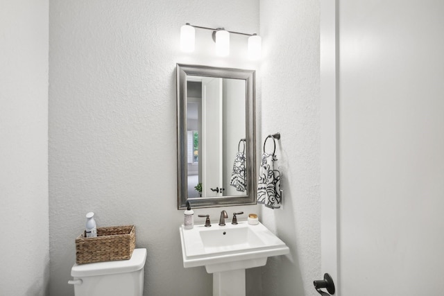 bathroom with toilet and sink