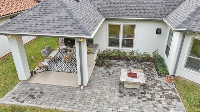 view of patio featuring a fire pit