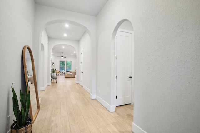 hall with light hardwood / wood-style flooring