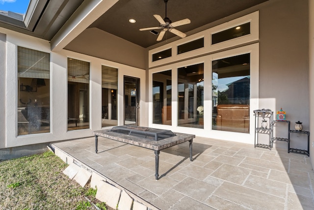 view of patio featuring ceiling fan