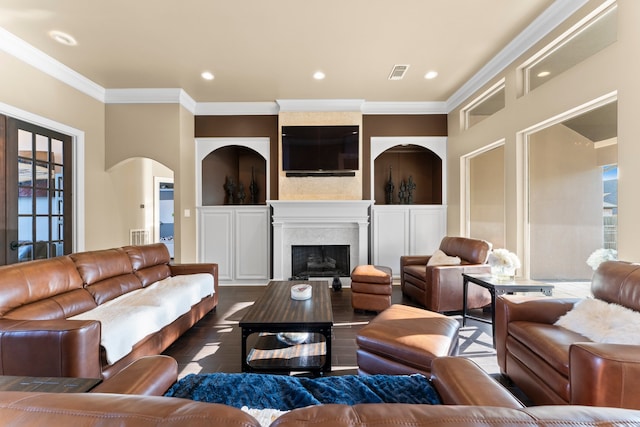 living room with a wealth of natural light and crown molding