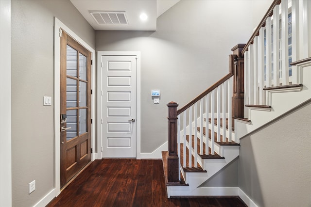 entrance foyer with dark hardwood / wood-style flooring