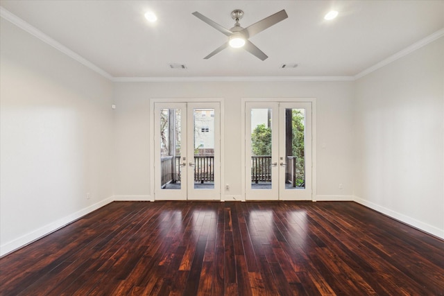 empty room featuring hardwood / wood-style flooring, ceiling fan, ornamental molding, and french doors