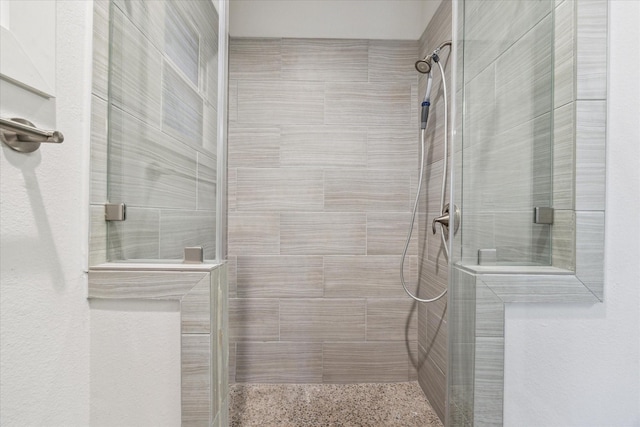 bathroom featuring tiled shower