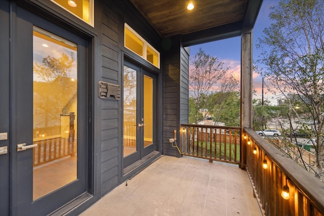 balcony at dusk with french doors