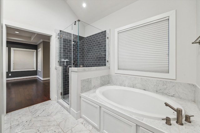 bathroom with crown molding and separate shower and tub