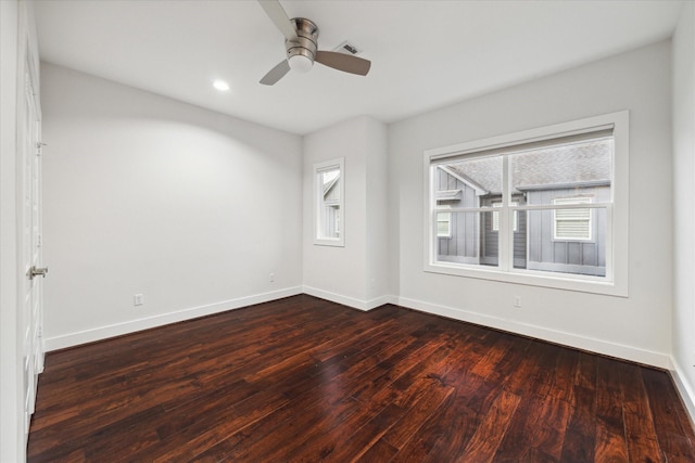 unfurnished room featuring ceiling fan and dark hardwood / wood-style flooring