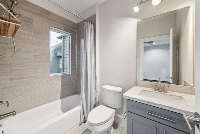 full bathroom with toilet, vanity, and shower / bath combination with curtain