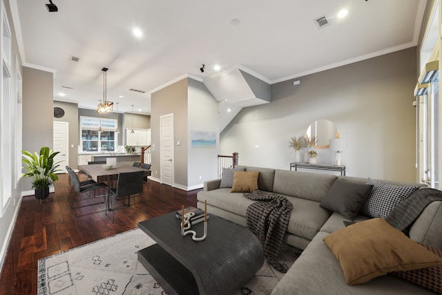 living room with dark hardwood / wood-style floors and ornamental molding