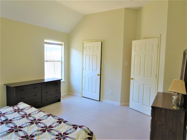 bedroom featuring vaulted ceiling