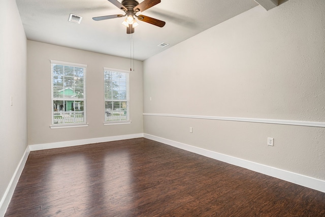 empty room featuring ceiling fan and dark hardwood / wood-style flooring