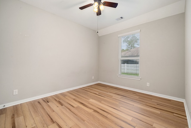 spare room with light wood-type flooring and ceiling fan