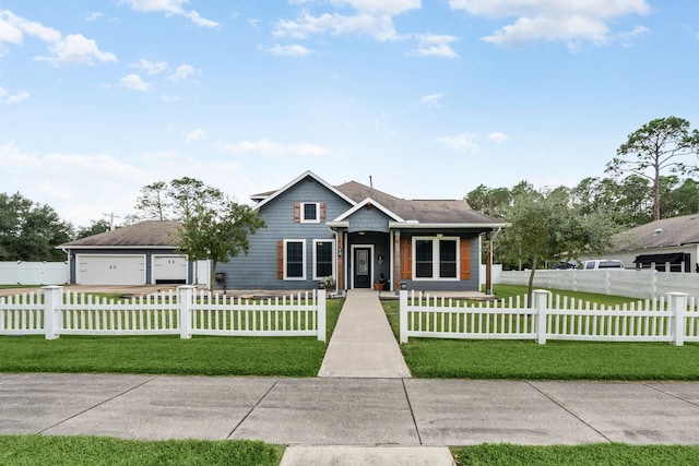 view of front of property featuring a garage and a front lawn