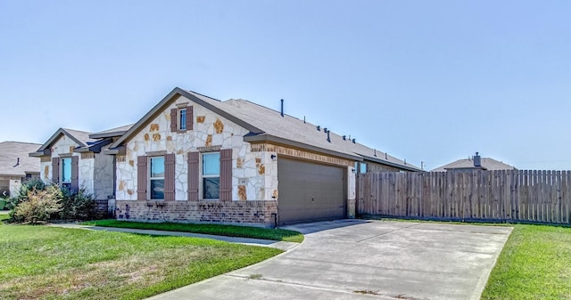 view of front of home featuring a garage and a front yard