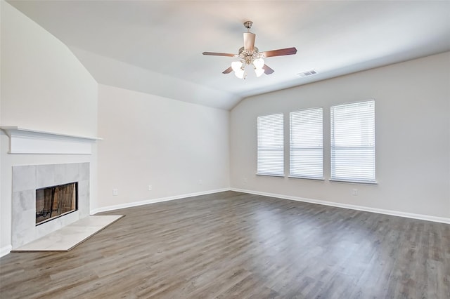 unfurnished living room featuring ceiling fan, vaulted ceiling, and dark hardwood / wood-style floors