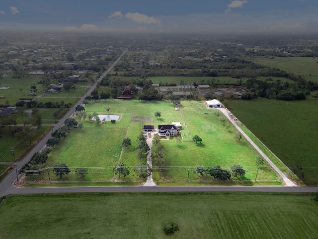 birds eye view of property featuring a rural view