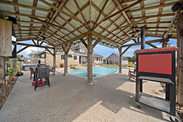 view of pool with ceiling fan and a patio area