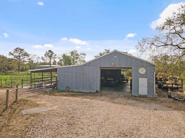 view of outbuilding featuring a rural view