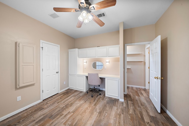 unfurnished office featuring ceiling fan and light hardwood / wood-style flooring