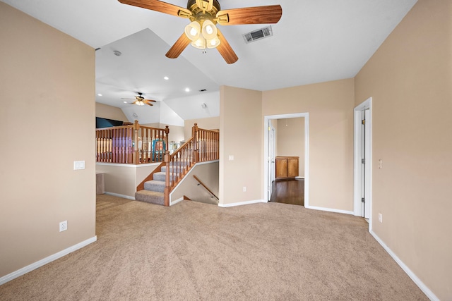 unfurnished living room featuring light colored carpet, ceiling fan, and vaulted ceiling