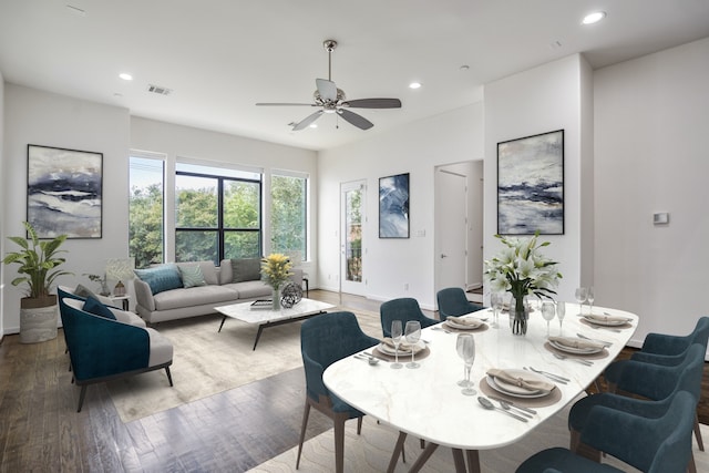 dining space featuring hardwood / wood-style flooring and ceiling fan