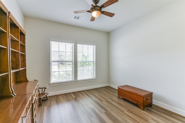 unfurnished room with ceiling fan and light hardwood / wood-style floors