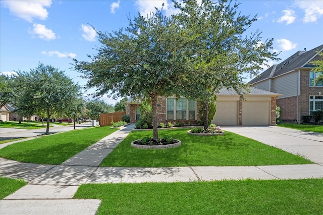 view of front of home with a garage and a front yard