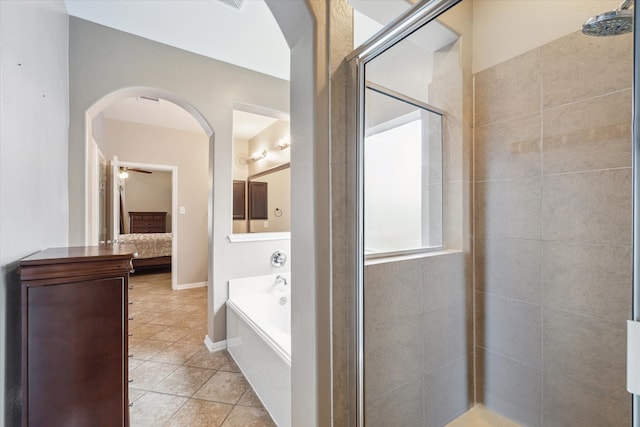 bathroom featuring tile patterned flooring, shower with separate bathtub, and ceiling fan