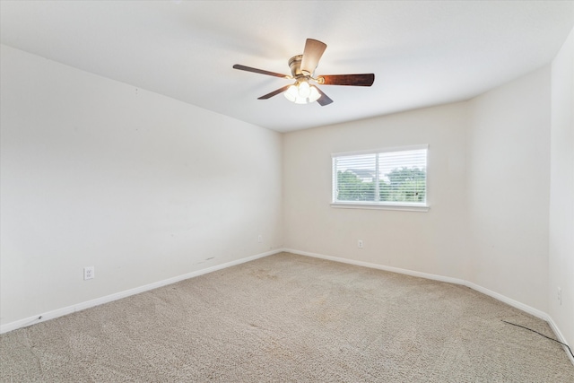 spare room with ceiling fan and carpet floors