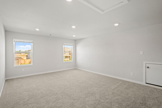 empty room featuring carpet flooring and a healthy amount of sunlight