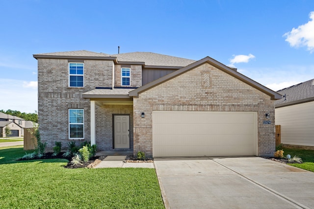 view of front of house featuring a garage and a front lawn