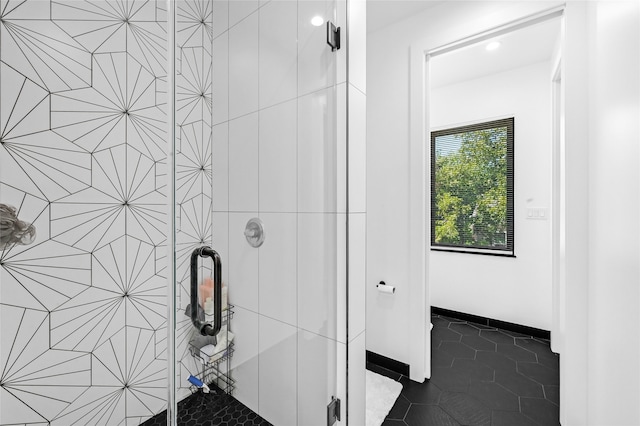 bathroom featuring a shower with door and tile patterned floors