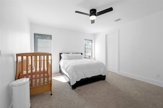 carpeted bedroom with ceiling fan