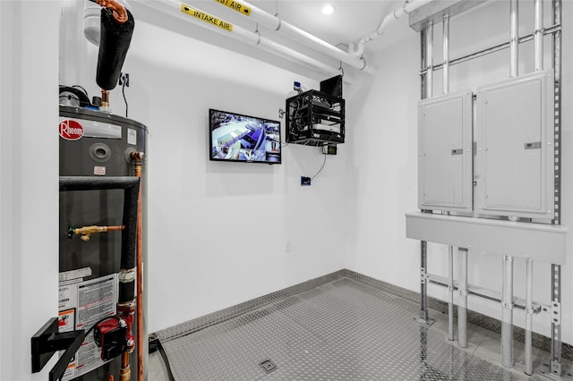 interior space featuring electric panel and water heater