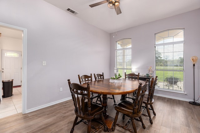 dining space featuring ceiling fan and light hardwood / wood-style flooring