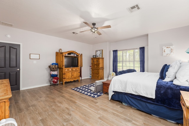 bedroom featuring hardwood / wood-style floors and ceiling fan