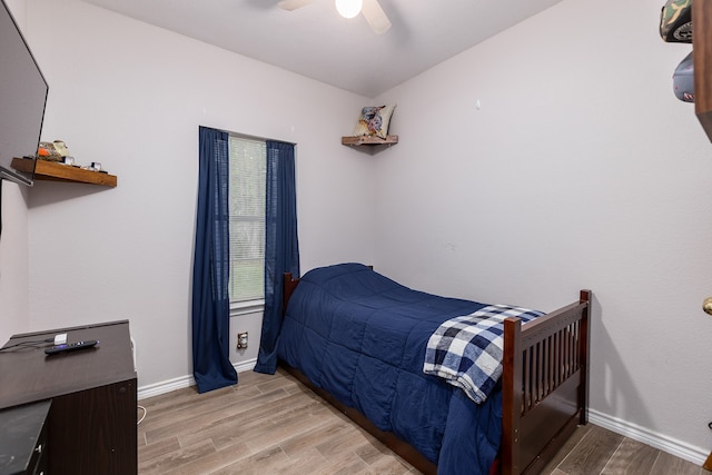 bedroom featuring hardwood / wood-style floors and ceiling fan