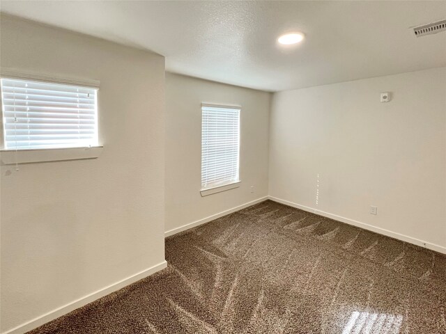 spare room featuring carpet flooring