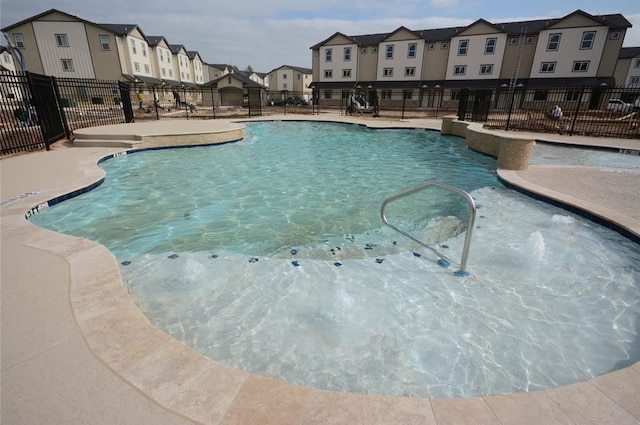 view of pool with pool water feature