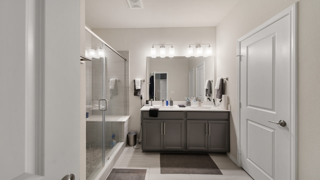 bathroom featuring vanity and a shower with shower door