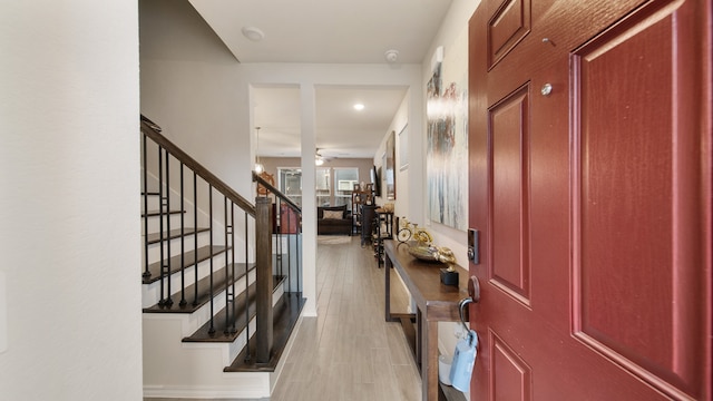 entryway featuring ceiling fan and light hardwood / wood-style floors