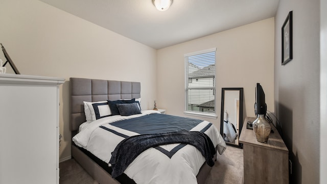 carpeted bedroom featuring lofted ceiling