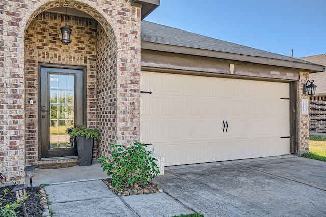 doorway to property featuring a garage